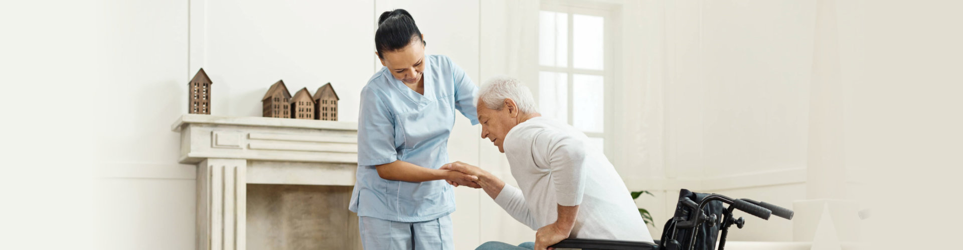 caregiver assisting to her patient to stand